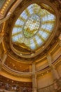 Elaborate golden decor of stained glass window mosaic on glass ceiling of Rotunda upward view