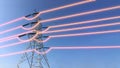 Electricity transmission towers with glowing wires Royalty Free Stock Photo