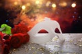 Image of elegant venetian mask and red roses over wooden table Royalty Free Stock Photo