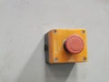 Image of emergency stop push button with pvc box mount on bending machine.