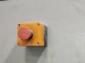 Image of emergency stop push button with pvc box mount on bending machine.