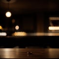 Empty dark wooden table in front of abstract blurred bokeh background of restaurant can be used for display or montage your Royalty Free Stock Photo