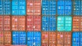 Ends of metal shipping crates containers stacked in colorful pastel formation