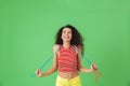 Image of energetic woman 20s wearing summer clothes working out and doing exercises with jumping rope Royalty Free Stock Photo