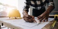 Image of engineer drawing a blue print design building or house, An engineer workplace with blueprints, pencil Royalty Free Stock Photo