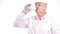 Image with an Engineer Drinking Cold Water from a Bottle Royalty Free Stock Photo