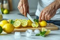 image envisions hands slicing lemon and mint on ice to create a refreshing drink Royalty Free Stock Photo