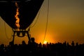 Image of the evening sun with the flaming silhouette with balloon is being.