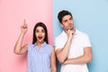 Image of excited man and woman in casual wear touching chins and Royalty Free Stock Photo