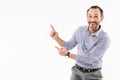 Excited surprised adult businessman showing copyspace. Royalty Free Stock Photo