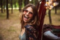 Image of excited woman 20s, wearing stylish accessories smiling Royalty Free Stock Photo