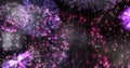 Image of exploding pink fireworks scrolling on black background