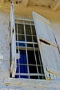 An old wooden shutter covers the exterior window at the St. Marks Lighthouse