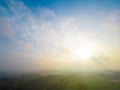 Soft Dawn Light Over a Hazy Countryside