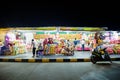 Image of fair games in Phnom Penh Cambodia. Image at night of colorful recreation activities.