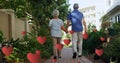 Image of falling hearts over caucasian senior couple walking Royalty Free Stock Photo