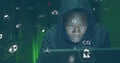 Image of falling icons over african american hacker