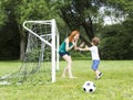 Image of family, mother and son playing ball in the park Royalty Free Stock Photo