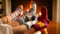 Image of family warming their feet at burning fireplace at living room Royalty Free Stock Photo