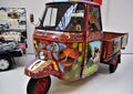 Image of the famous `bee` three-wheeled commercial vehicle made a pictorial work of art in the Piaggio museum.