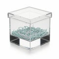Acrylic cube with shredded paper inside, isolated on white background Royalty Free Stock Photo