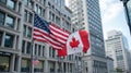 American and Canadian Flags Displayed in Urban Cityscape Royalty Free Stock Photo