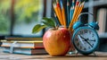 Back to School Essentials: Apple on Piled Books with Pencils and Alarm Clock Royalty Free Stock Photo