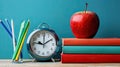 Back to School Essentials: Apple on Piled Books with Pencils and Alarm Clock Royalty Free Stock Photo