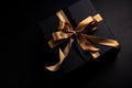 Black Gift Box with Golden Bow Overhead View Royalty Free Stock Photo