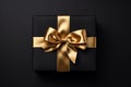 Black Gift Box with Golden Bow Overhead View Royalty Free Stock Photo