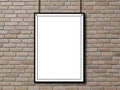 Blank poster frame hanging on brick wall isolated on white background Royalty Free Stock Photo