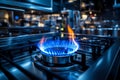 A vibrant blue flame burns brightly on a modern gas stove. This image showcases sleek kitchen design and the warmth of Royalty Free Stock Photo