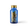 Blue glass bottle with capsules, isolated on white background Royalty Free Stock Photo