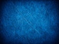 Blue textured background with abstract grunge scratches for creative designs. Royalty Free Stock Photo