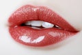 The image features a bold, shiny red lipstick mark on a plain white surface Royalty Free Stock Photo