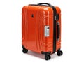 Bright orange hardshell suitcase with wheels Royalty Free Stock Photo