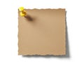 Brown paper note with pushpin, isolated on white background Royalty Free Stock Photo