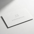 Business card with js and stratton & co. isolated on white background Royalty Free Stock Photo