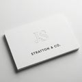 Business card with js and stratton & co. isolated on white background Royalty Free Stock Photo