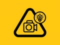 Creative icon showing camera with lightbulb inside warning triangle Royalty Free Stock Photo