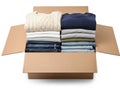 Stacked clothes in box, isolated on white background Royalty Free Stock Photo