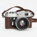 Classic camera with leather strap isolated on white background Royalty Free Stock Photo