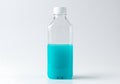 A Clear Plastic Bottle Half Filled with Vibrant Blue Liquid on White Background for Refreshment and Hydration Royalty Free Stock Photo