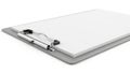 A grey clipboard with white paper stack and metal clip on an isolated white background Royalty Free Stock Photo
