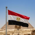 The image features the Egyptian flag, colored red, white, and black with the gold Eagle Royalty Free Stock Photo
