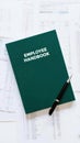 Employee Handbook on Office Desk Royalty Free Stock Photo