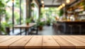 Empty Wooden Table Top in a Blurred Cafe Setting Royalty Free Stock Photo