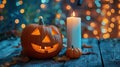 Festive Halloween Decor with Jack-o\'-Lanterns, Candles, and String Lights on Wooden Table Royalty Free Stock Photo