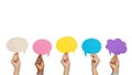 Hands holding colored speech bubbles isolated on white background Royalty Free Stock Photo