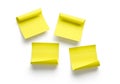 Four bright yellow sticky notes arranged in a square formation on a white background Royalty Free Stock Photo